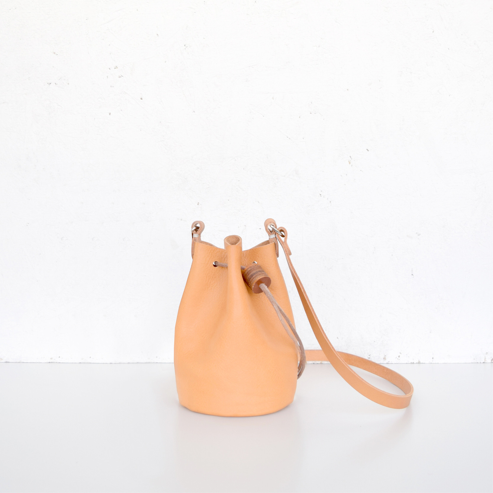 Minimalistic British bucket bag by Alfie Douglas