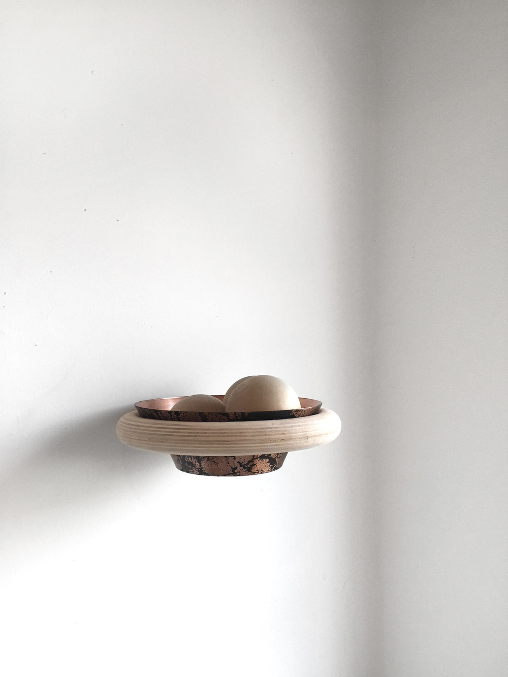Wall mounted wood and aluminium bowl