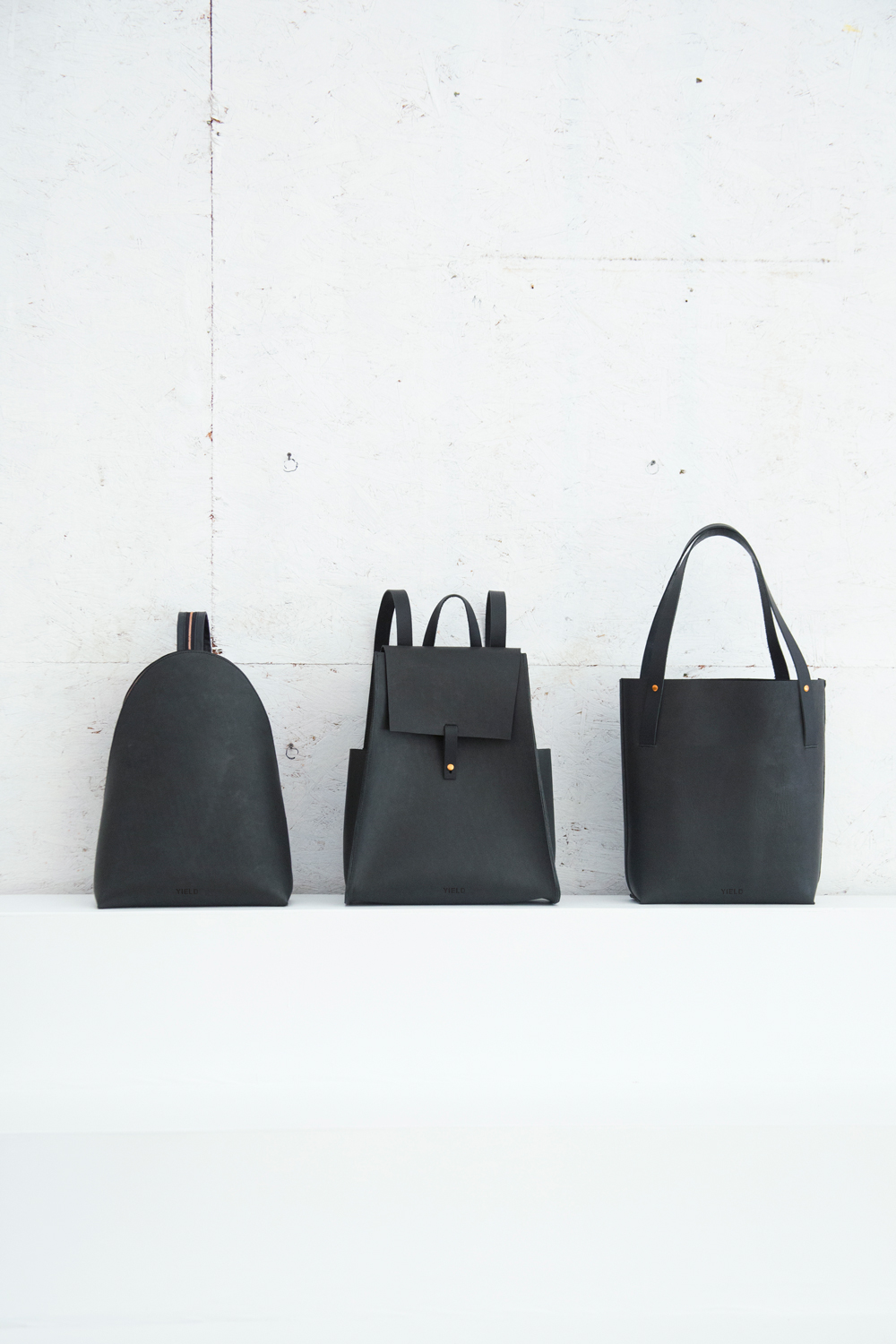 Yield | simple leather backpack and shopper