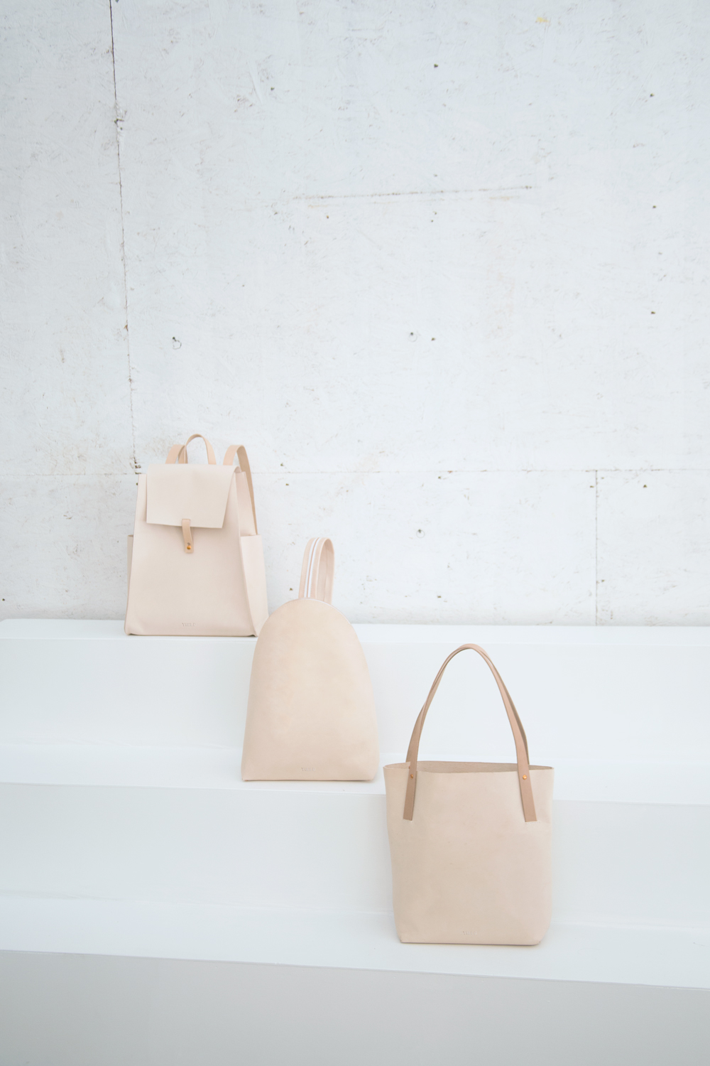 Yield | simple nude leather backpack and shopper